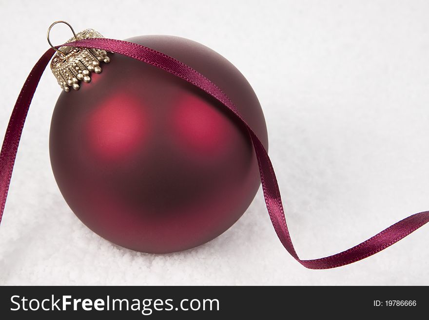Red Christmas Bauble Ornament on snow background. Red Christmas Bauble Ornament on snow background