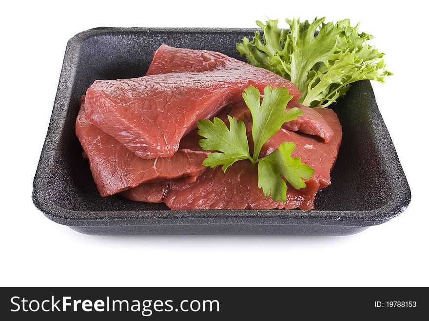 Raw beef frying steak in black tray isolated over white background. Raw beef frying steak in black tray isolated over white background