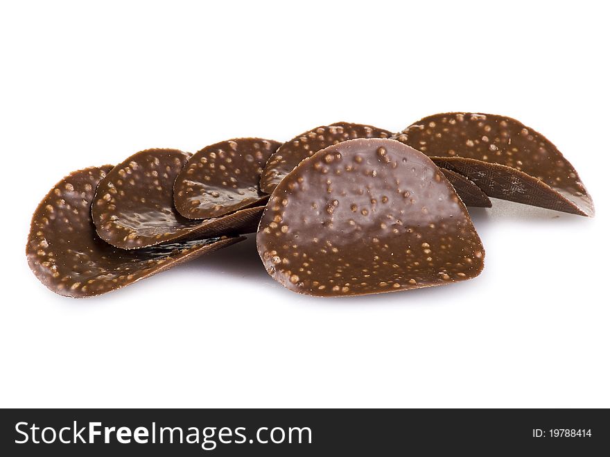 Chocolate chips isolated over white background