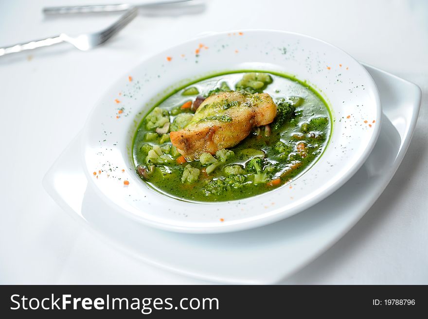 Fish steak and green stew