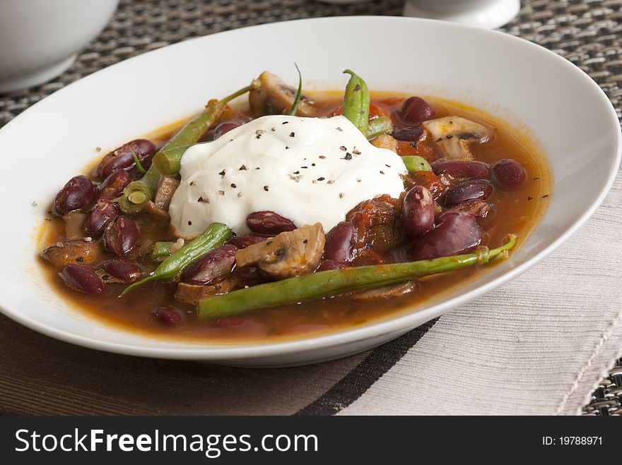 Vegetable chilli with green beans and creme fraiche