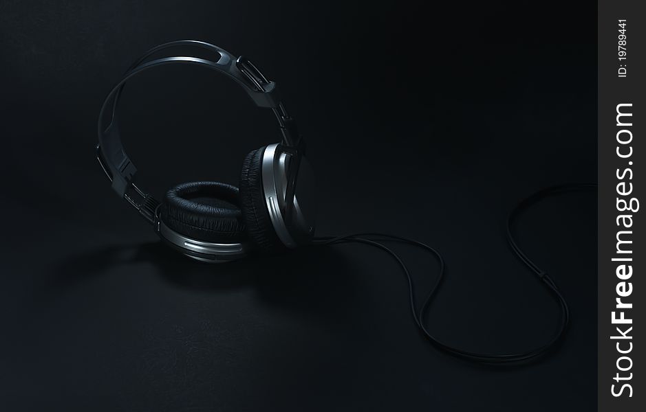 Silver big headphones on black background