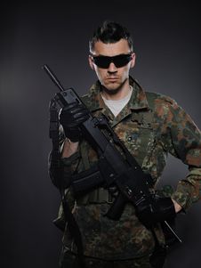 Young Soldier In Camouflage With A Gun. Stock Image