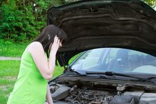 The Girl Speaks By Phone About A Car Stock Photography