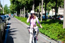Woman Riding A Bike While Making Pictures Stock Photo Woman Riding A Bike While Making Pictures Stock Photo