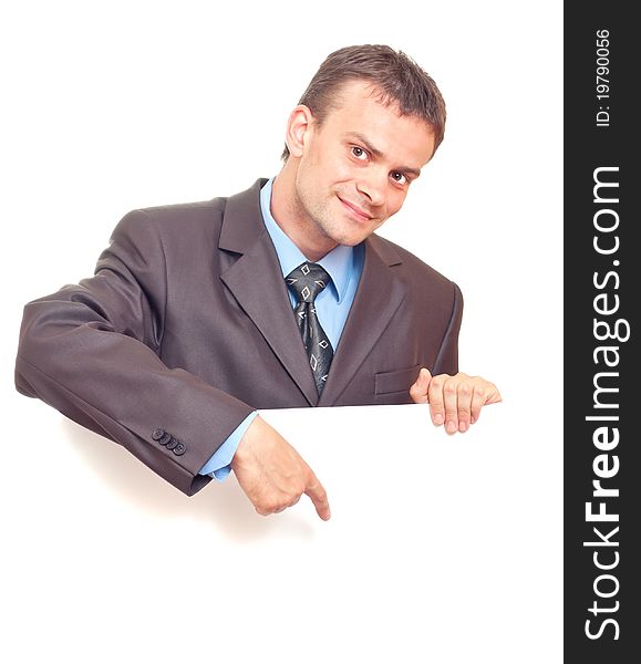 Young businessman points his finger at the white background