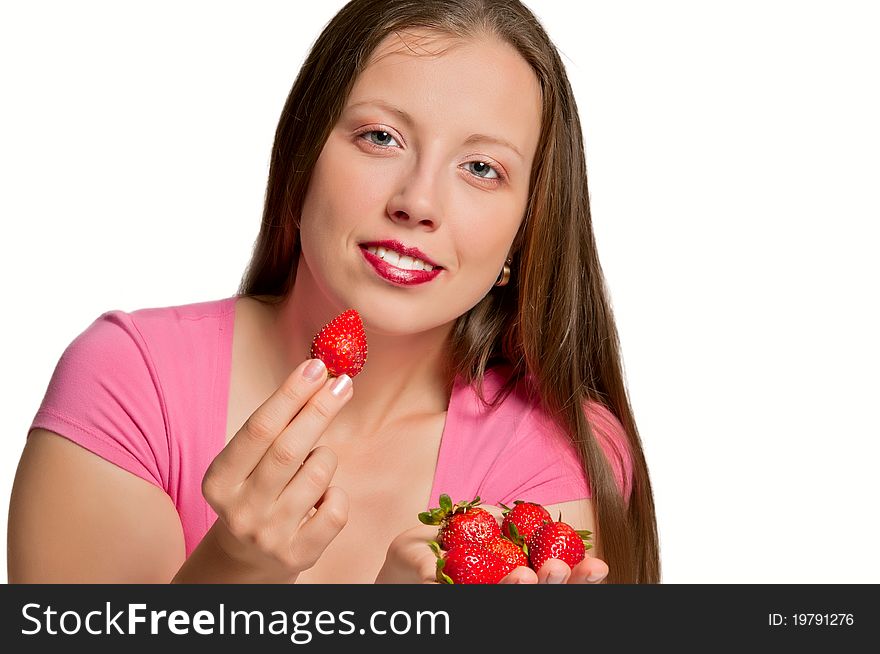Beautiful girl stretches strawberries which is in her hand. Beautiful girl stretches strawberries which is in her hand