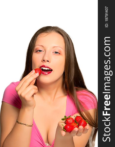 Beautiful girl stretches strawberries which is in her hand. Beautiful girl stretches strawberries which is in her hand