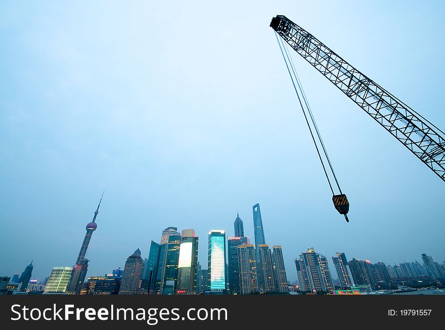 Shanghai in construction with crane. Shanghai in construction with crane