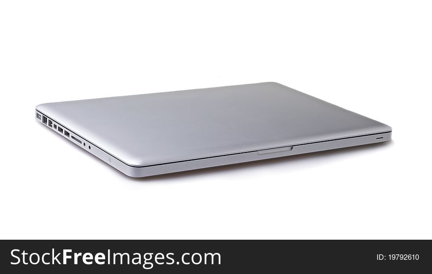 Silver portable computer. Isolated white screen. Silver portable computer. Isolated white screen.
