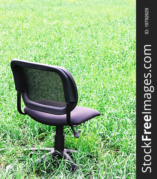 Black chair in the field