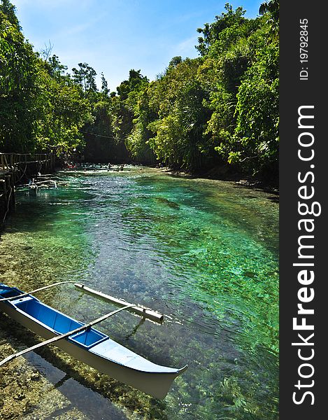 A solitary boat dock that invites tourists for a short trip around the narrow river