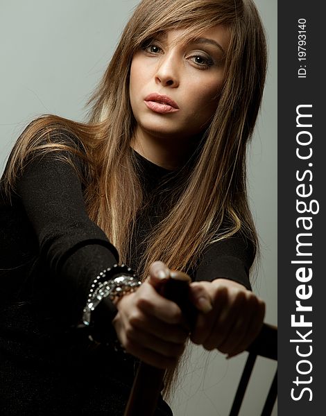 Young  lady with accessories portrait in dark tones