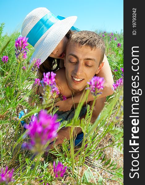 Young Couple Lying On Grass