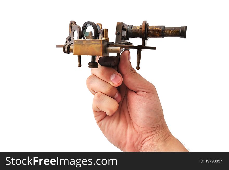 Old sextant in hand on a white background
