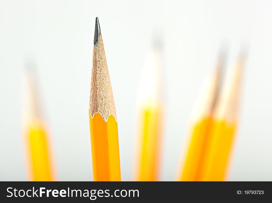 Yellow pencils against a white background