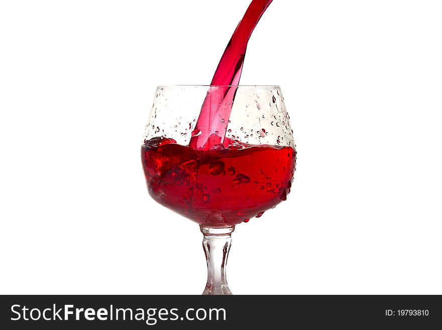 Red wine pouring into wine glass