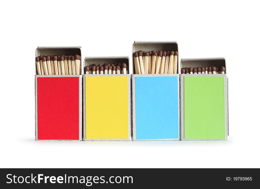 Few variegated matchboxes in a row isolated on white background. Clipping path is included. Few variegated matchboxes in a row isolated on white background. Clipping path is included