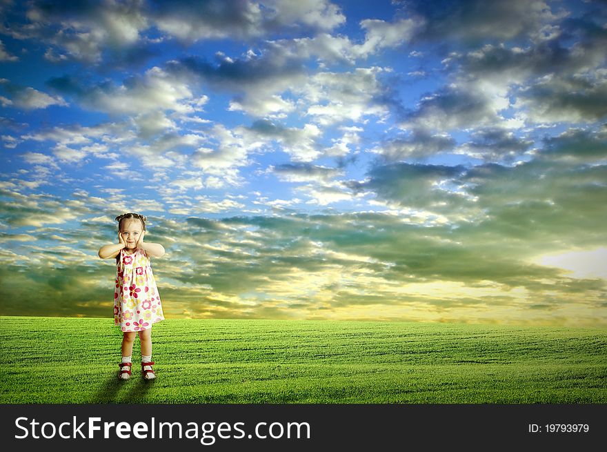 The child playing in the field.Oytdoor