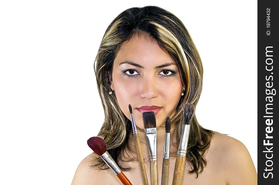 Portrait of beautiful woman with brushes