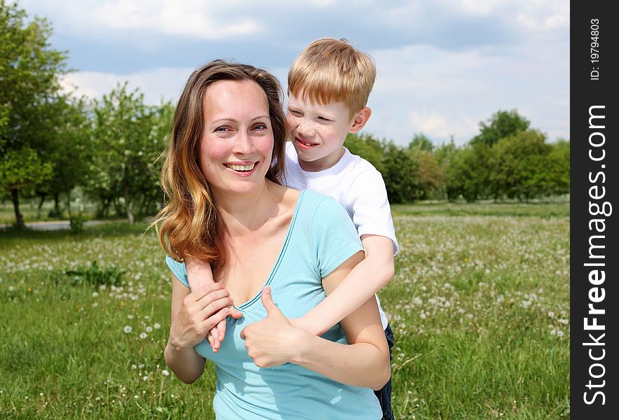 Young mother with her son outdoors relaxing