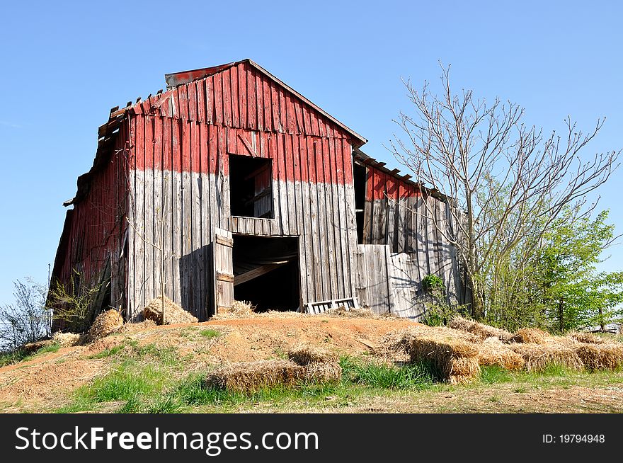 An old red barn on a hill