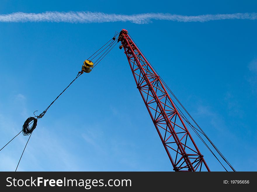 The elevating crane on blue sky