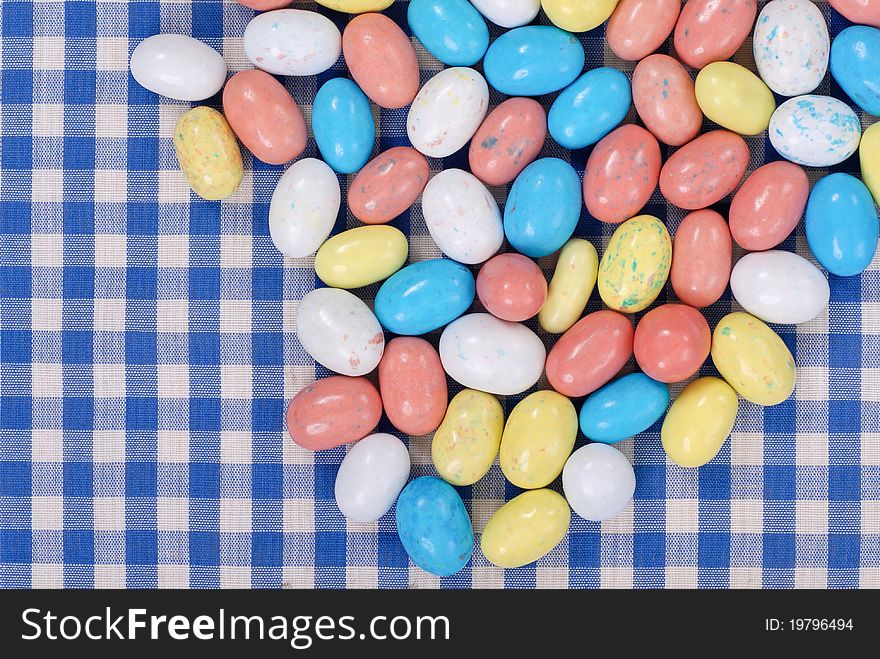 Colored Malt Chocolate Candies On Colorful Table Cloth