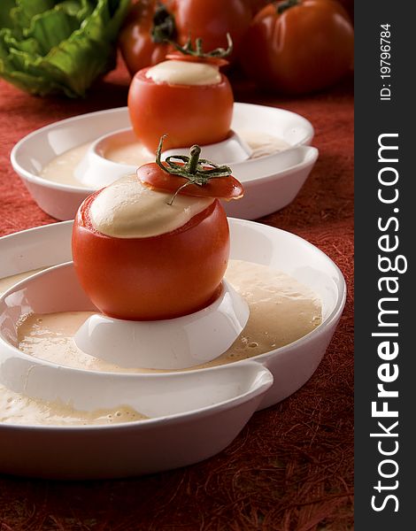 Detail of tomatoes stuffed with cream