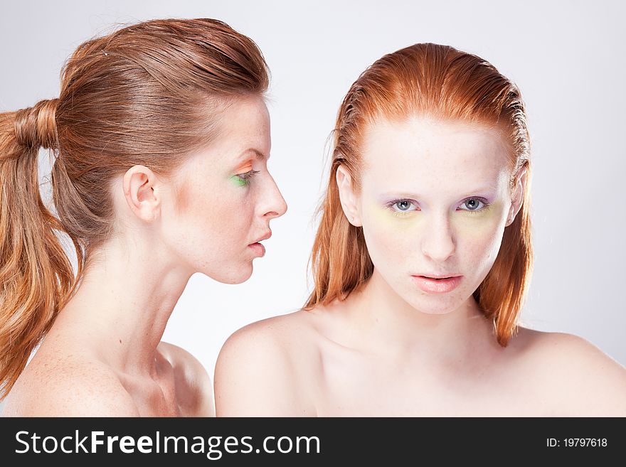 Two Beautiful Red-haired Woman Confront