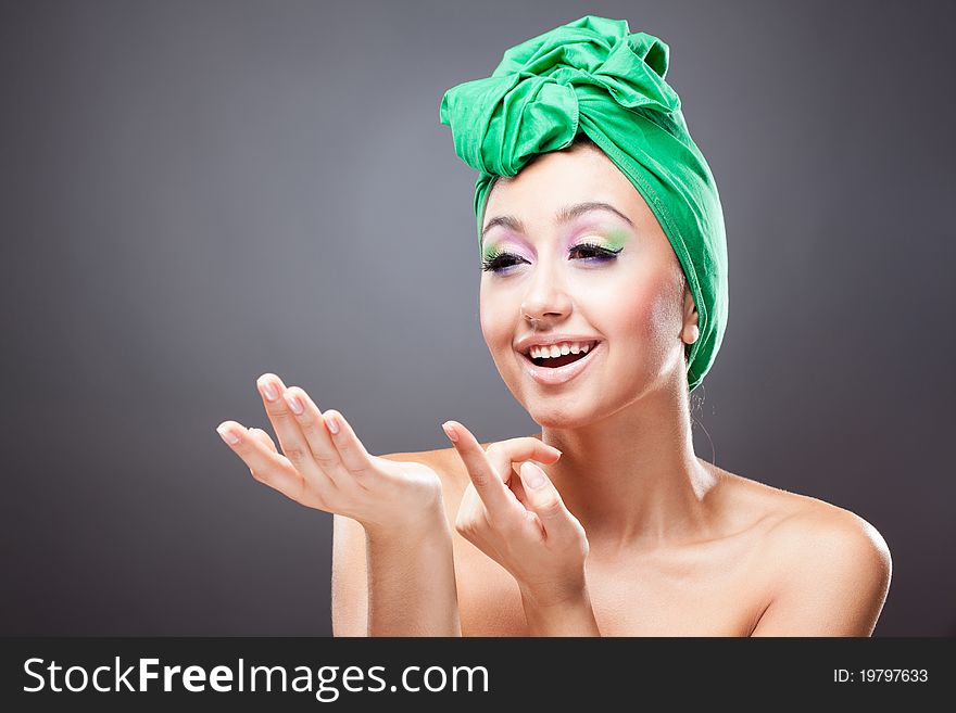 Happy smiling woman invite pointing witn finger. Happy smiling woman invite pointing witn finger