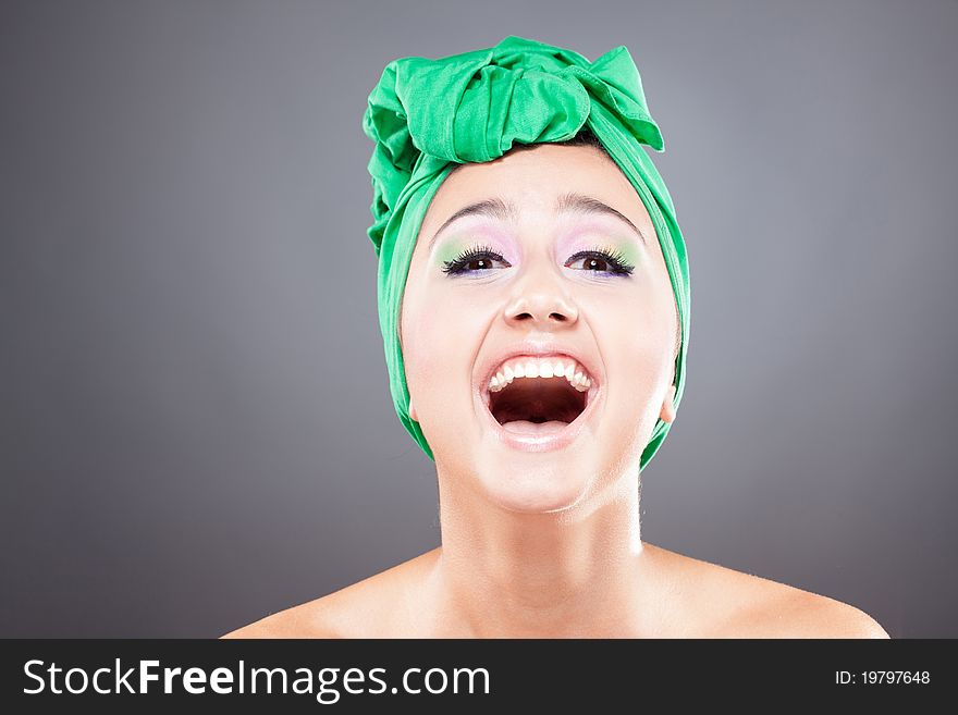 Happy smiling young woman looking at camera