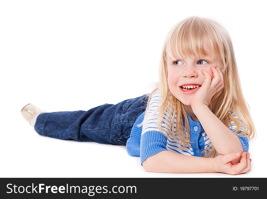 Happy smiling little girl lie dreaming