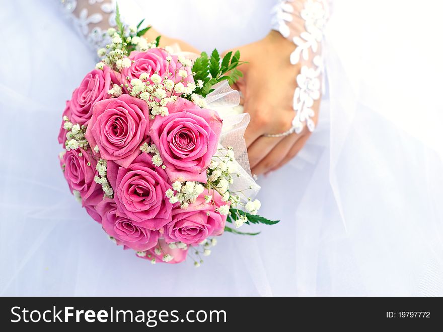 Bridal bouquet in the hand of bride. Bridal bouquet in the hand of bride