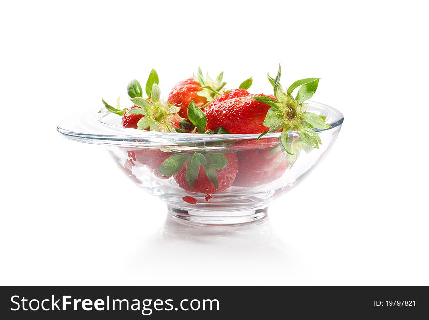 Tasty strawberries in a bowl isolated on white background