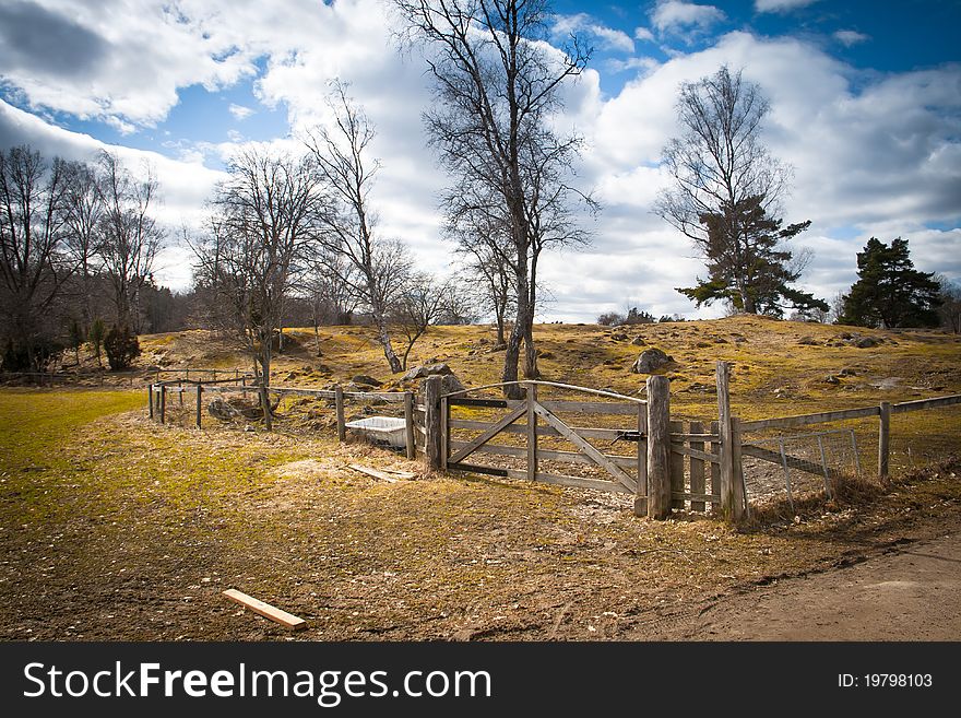 A wooden gate on a field in Sweden