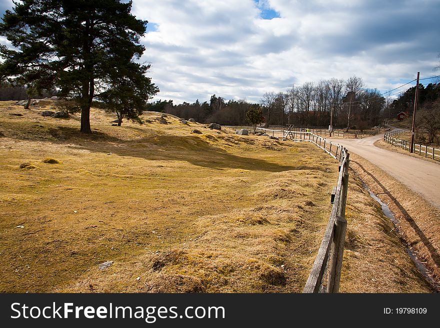 A wooden fence on a field in Sweden. A wooden fence on a field in Sweden