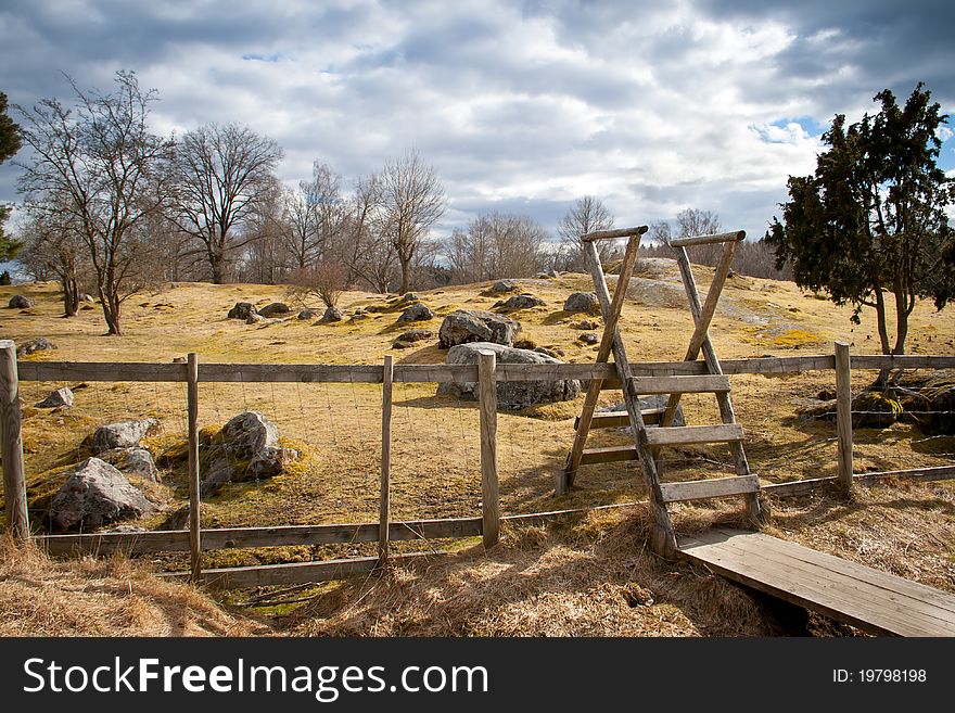 A wooden gate on a field in Sweden. A wooden gate on a field in Sweden