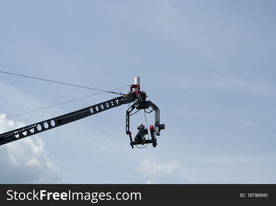 Mobile video camera against the blue sky