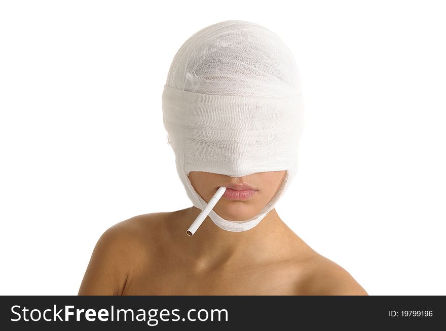 Woman with head bandaged with cigarette