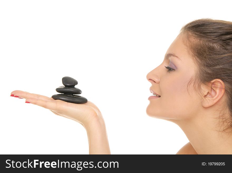 Woman holding pile of stones on the palm of your hand isolated on white. Woman holding pile of stones on the palm of your hand isolated on white