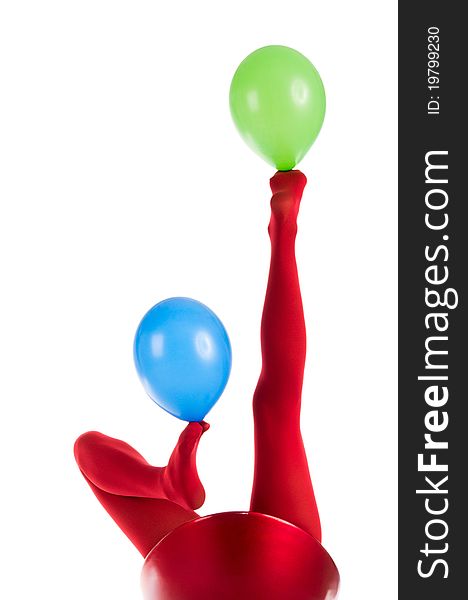 Female feet in red stockings with balloons isolated in white