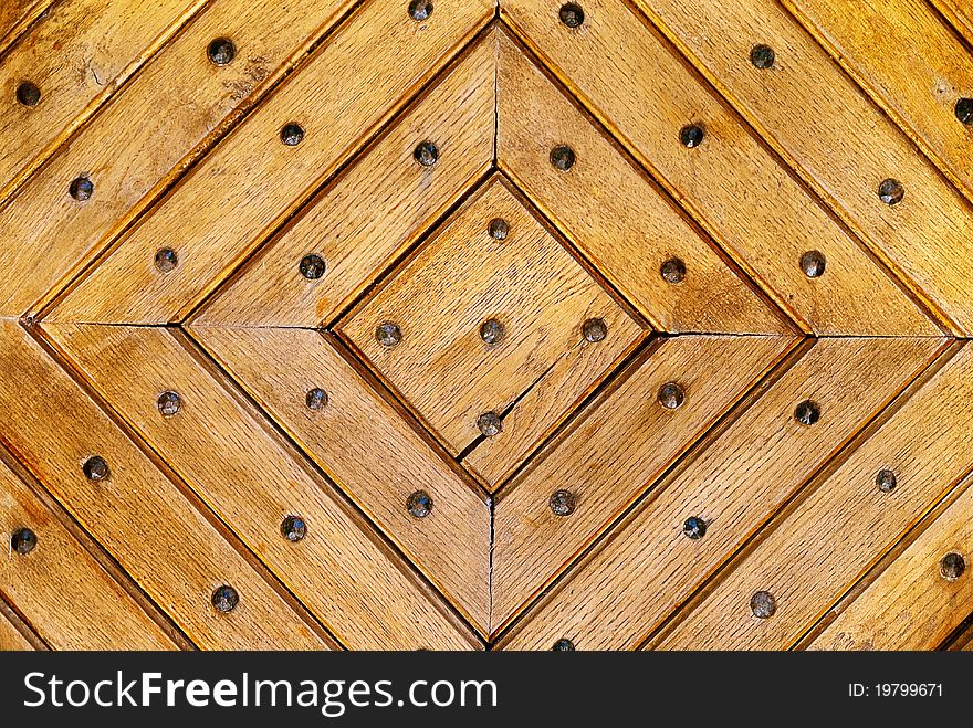 Natural wood background with iron rivets