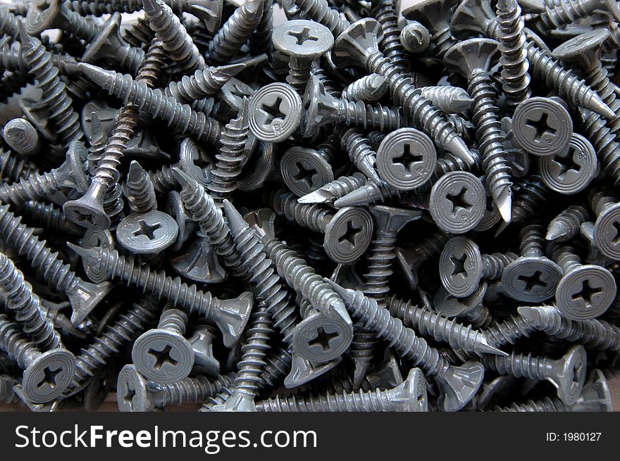 Screws scattered in a box