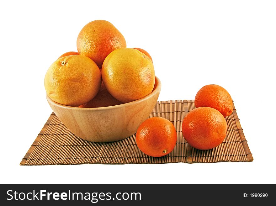 Grapefruits and oranges on a wooden basket