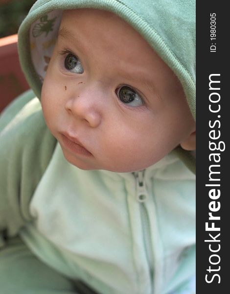 Image of cute baby wearing a hooded jacket. Image of cute baby wearing a hooded jacket