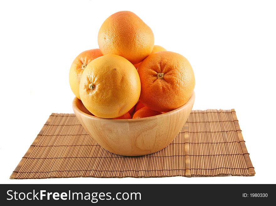 Grapefruits in a wooden basket. Grapefruits in a wooden basket