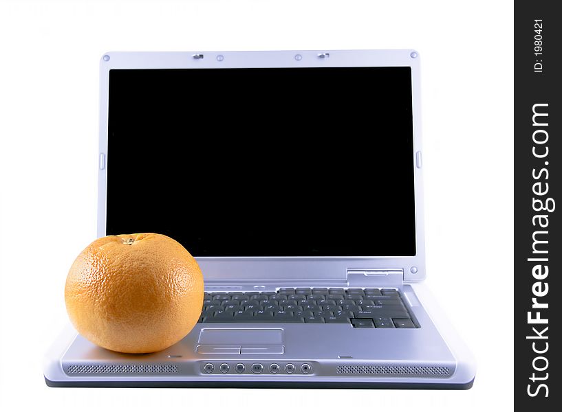 Laptop and grapefruit selected on a white background