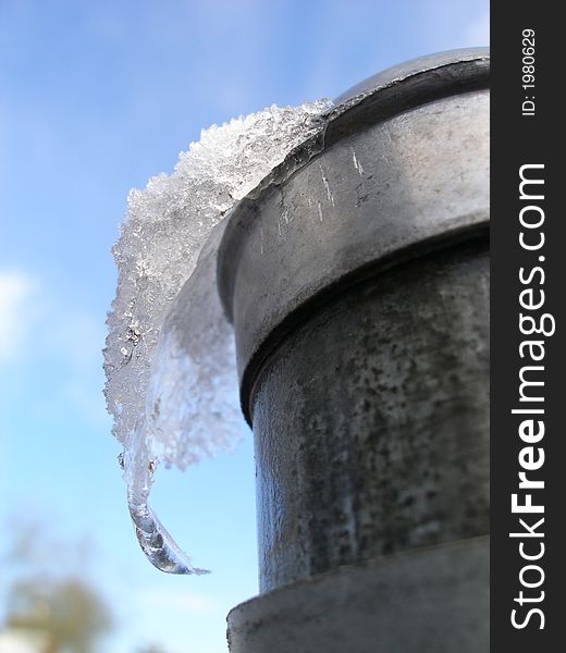 Snow and ice formation on metal pole. Snow and ice formation on metal pole