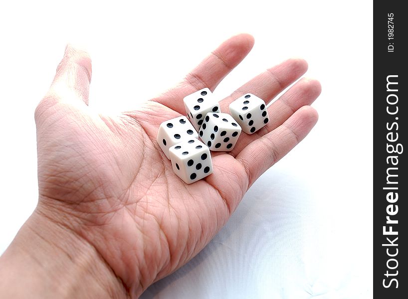 Five white dices on a hand with white background